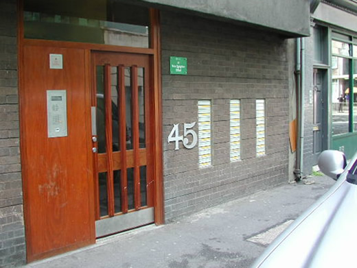 Entrance door to block of flats brought forward to remove the recess
